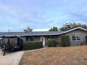 Single-story home with a completed roofing project by MEK Roofing.