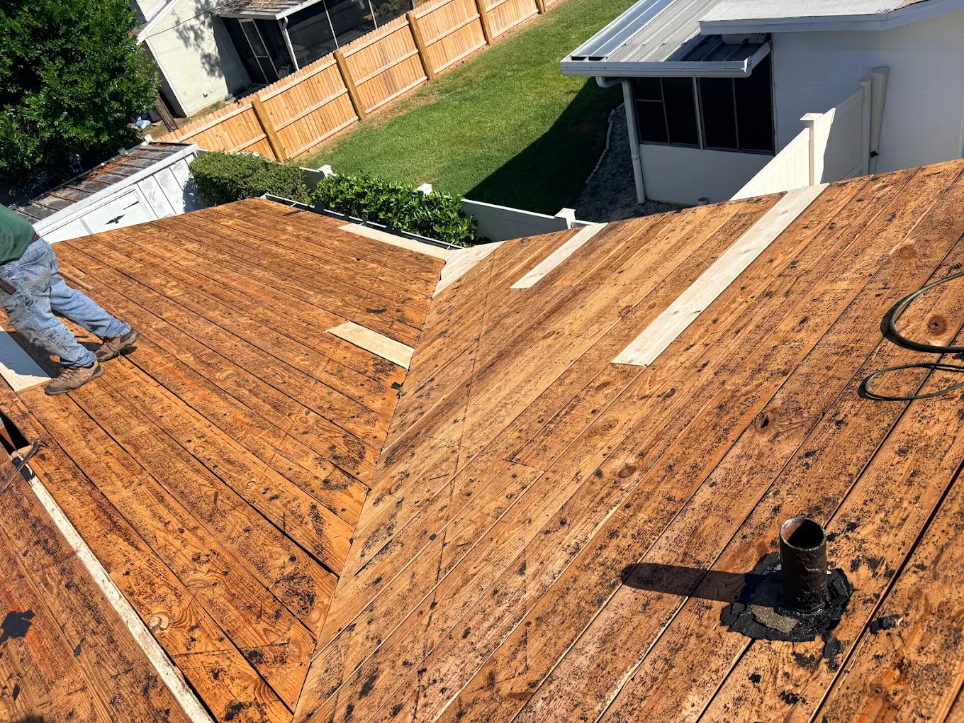 Roof decking exposed and prepped during a roofing replacement project.