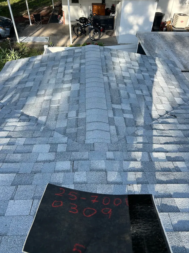 Finished gray shingle roof viewed from the ridge line.